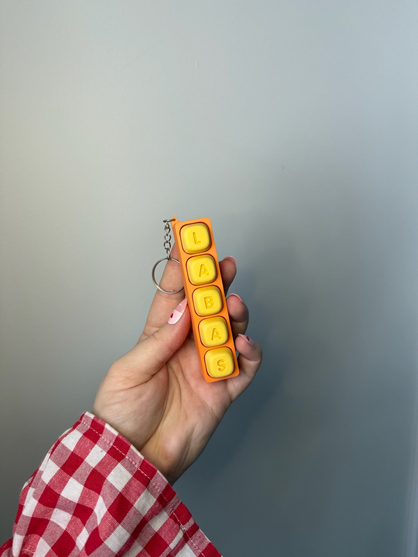 Personalizuotas fidget pakabukas - žaislas