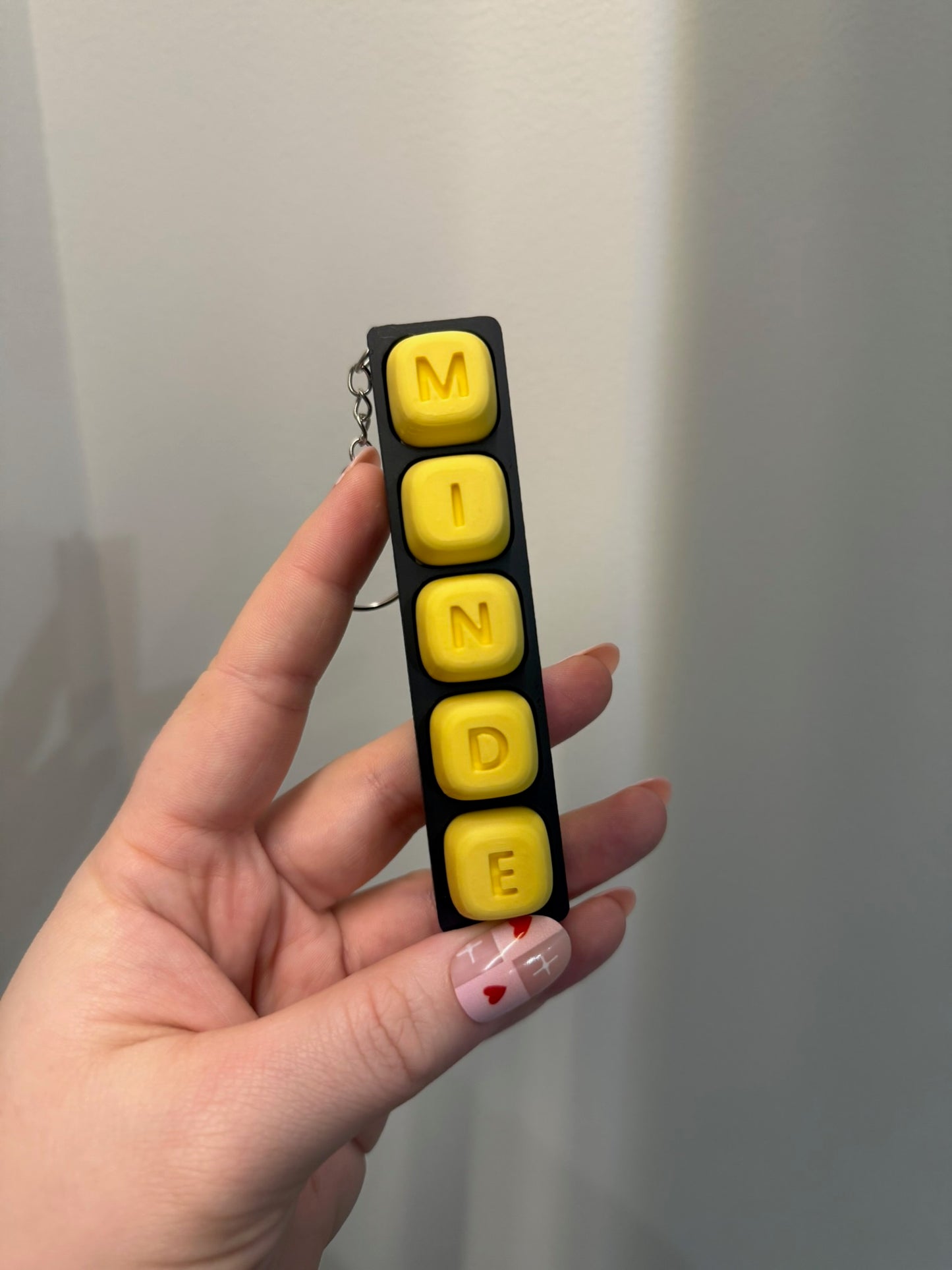 Personalizuotas fidget pakabukas - žaislas